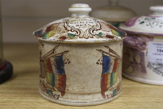 A Sunderland pink lustre jar and cover and two other jars and covers